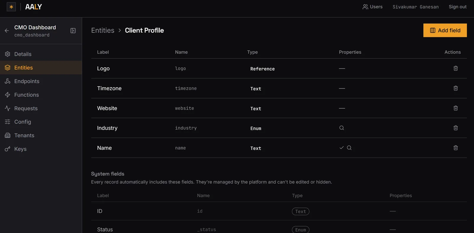 The Aaly dashboard showing the fields on a Client Profile entity — logo, timezone, website, industry and name — with types and properties, above the system fields every record receives.